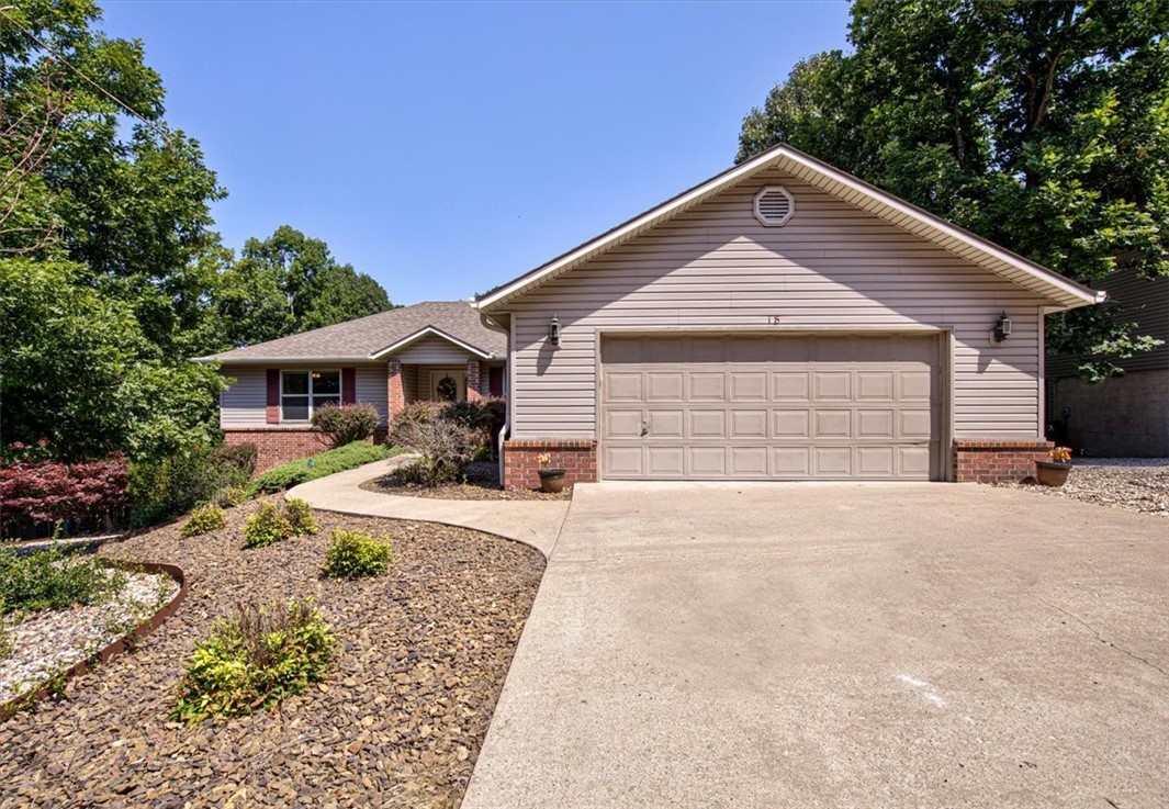 Step into this delightful Bella Vista residence! Location is of note! Situated in a beautiful, quiet neighborhood, perfect for raising a family. Near a few of the well-known Bella Vista walking trails, Loch Lomond Lake and Lake Avalon, perfect for outdoor enthusiasts. The exterior of the home is nicely landscaped and welcomes you upon arrival. Inside this spacious home boasts of 3 beds, 2 baths and 1724 sqft. Featuring a generously sized living room, complete with carpeting, a fireplace, and ample windows. The kitchen showcases wrap-around counters and abundant cabinets, with the refrigerator included in the property. A separate laundry room, equipped with a convenient faucet, adds to the practicality. The bedrooms, also carpeted and spacious, offer comfort and relaxation. Step outside onto the partially covered wood deck, ideal for entertaining guests. The property sits on 0.30 acres of land, providing ample space to personalize and make it your own outdoor haven.