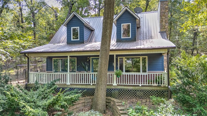 Discover the perfect mix of modern updates and country charm on this private 10-acre wooded retreat. The home features a remodeled kitchen and bathrooms, freshly painted living areas, and an open-concept design with large windows that fill the space with natural light. A cozy wood stove and loft with built-in shelving add warmth and character. Step outside to 2 pole barns, storage buildings, and a versatile stand-alone multi-purpose room with electricity and a wall HVAC unit—ideal for a studio, office, or guest quarters. Designed for mini-farm living, the property includes a chicken yard, horse stable, beautiful native plantings, and a charming playhouse. Beautiful natural rock outcroppings complete this one-of-a-kind setting, offering endless possibilities for recreation, homesteading, or simply enjoying the peace and beauty of nature.