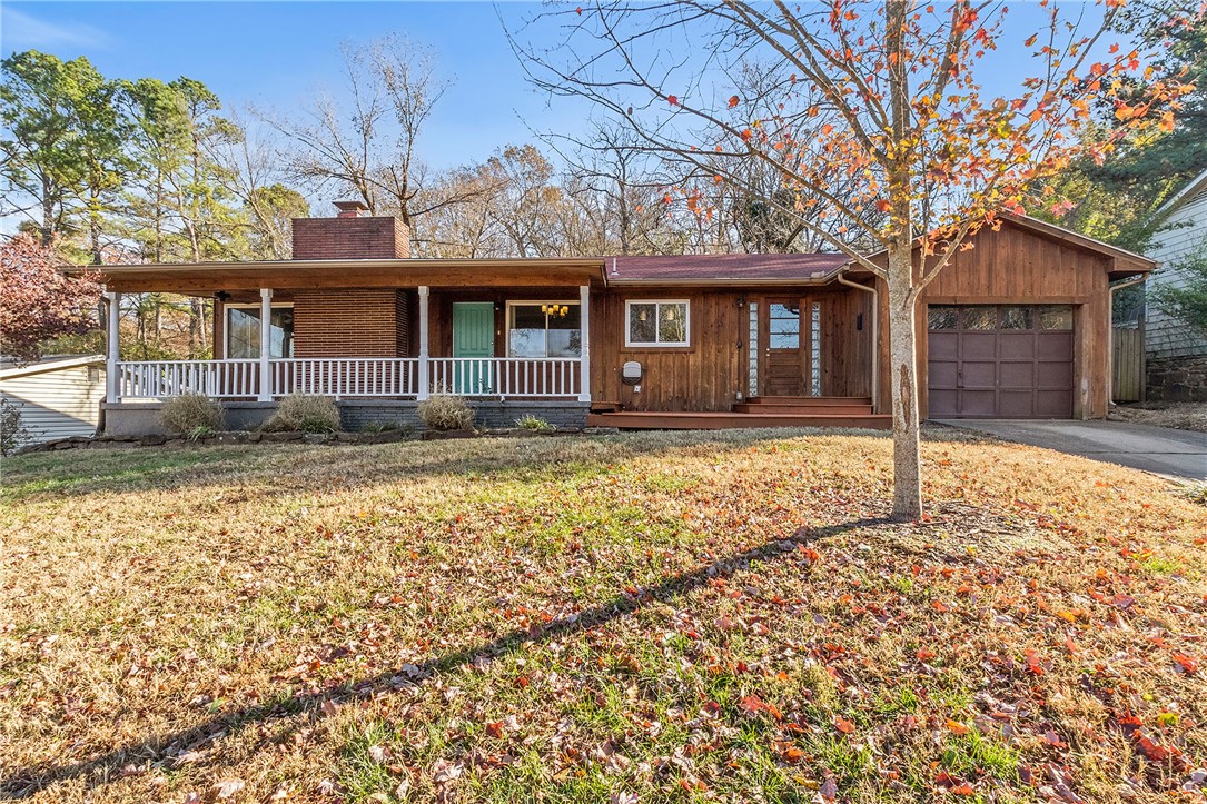 In the heart of the Fayetteville Historic District awaits your new home in this absolute treasure ready for your family to loveājust minutes to everything. An inviting covered front porch is perfect for relaxing on a brisk Fayetteville morning while enjoying a hot cup of coffee. After coffee, open your front door and youāre greeted by a large open living area with wood floors, floor to ceiling brick wood-burning fireplace and large windows providing plenty of natural light. Your kitchen features a funky checkerboard floor, granite countertops, stainless appliances, white cabinets and a perfect window for enjoying the hummingbirds while preparing family meals. Primary bedroom features wood floors and an extra room that could be an office or nursery. En-suite has dual vanities, cool tiled shower and Jacuzzi tub. Two additional sunlit bedrooms feature wood floors and large windows. One room also includes a gorgeous built-in. A large deck is out back to enjoy natureādeer visit oftenātreehouse, privacy screen and swing.