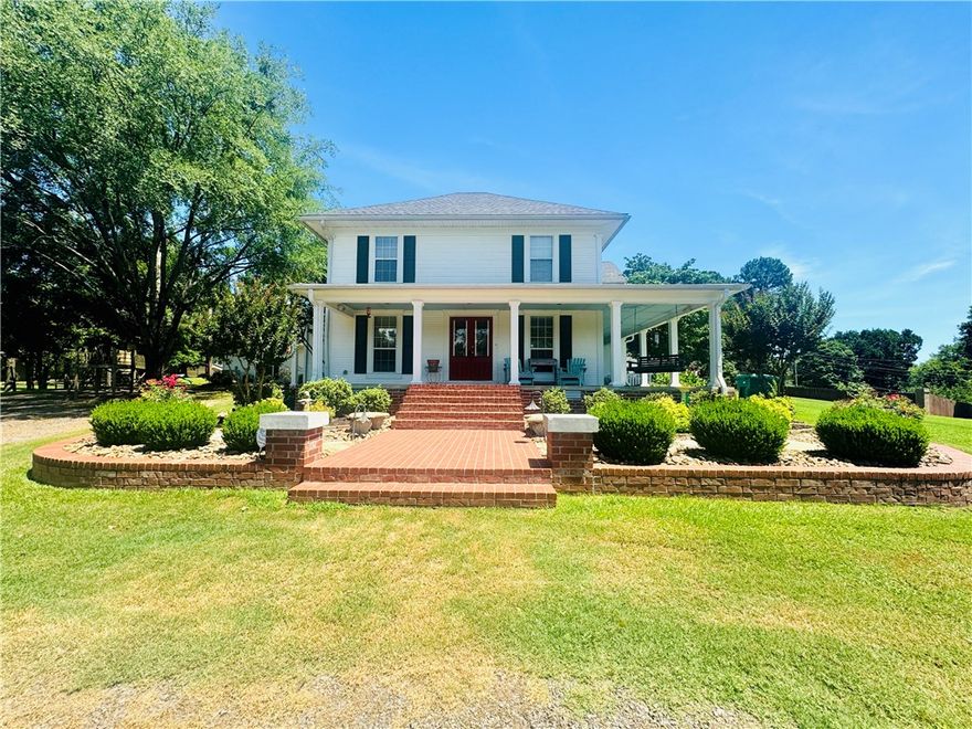 This charming, southern style home is truly unlike any other home on the market. This amazing property features three bedrooms, two and a half bathrooms in the main house and another bedroom and full bath in the guest house. This set up is perfect for guests and those enjoying the beautiful pool in the summertime. The stain glass front door, the original hardwood floors, and the gorgeous front porch, are just some of the unbelievable features this fantastic home has to offer. The backyard is fenced in with a beautiful pool, shop, and a covered back porch. With a little over two acres, you also get privacy, space, and a picturesque setting. Main home is 2756 square feet and guest house is 792 square feet totaling 3,548.