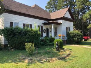 IF YOU LOVE . . . wood moldings, attics, large rooms, this one's for you! You'll love the high ceilings, the large bedrooms, center island in the kitchen. Hardwood floors, Large living room for family get together. A Fenced back yard.And a new roof.