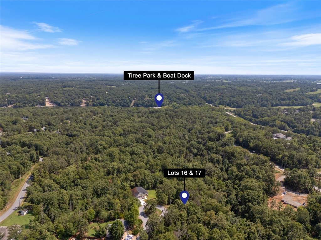 Two adjoining lots totaling 0.79 acres (Lot 16 = 0.37 ac, Lot 17 = 0.38 ac; Parcel #16-38634-000) to be sold together. Located in a quiet cul-de-sac with quick exit access from I-49. Buildable, gently sloping terrain with water and electric available at the street. Partially wooded setting offers privacy while still being close to Highlands Golf Course, Loch Lomond, and amenities. Bella Vista community ammenities granted through POA. Land survey included. Great opportunity to build your dream home in a convenient location!