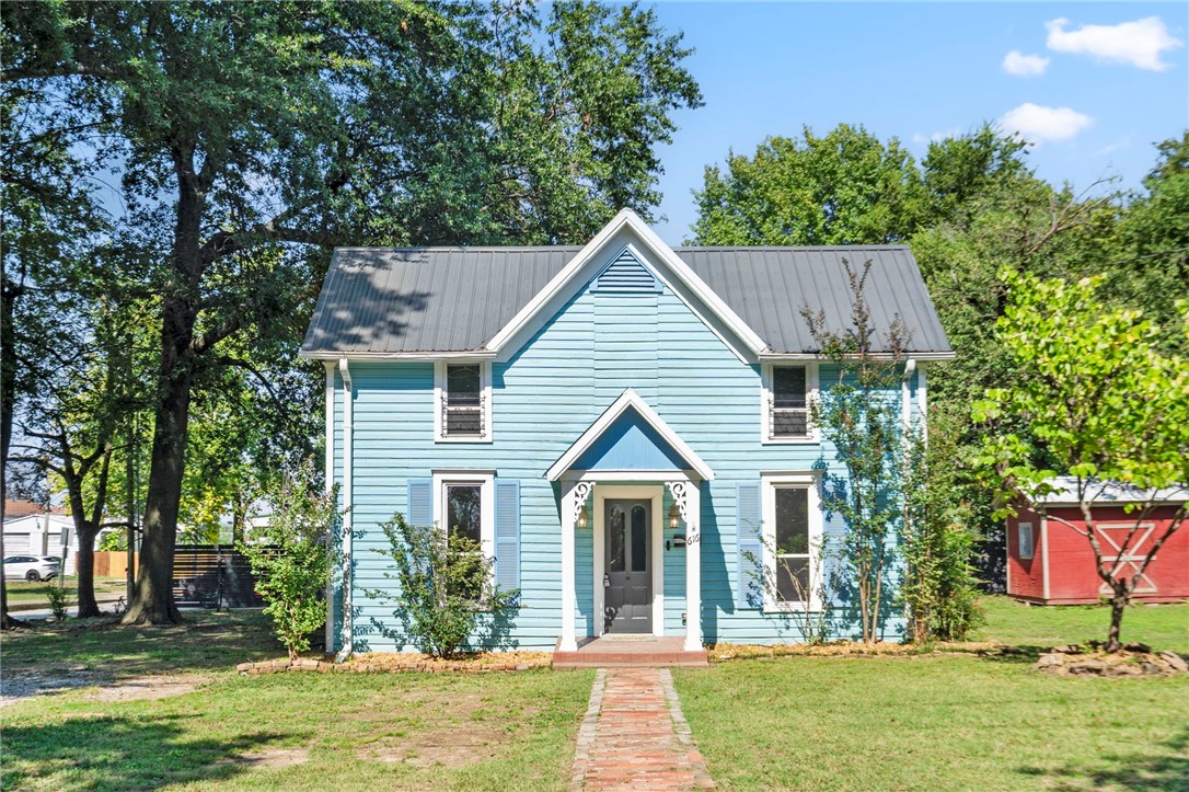Step back in time with this beautifully updated 1895 cottage-style home on a large corner lot in Downtown Springdale! Just blocks from the Razorback Greenway and an easy stroll to local coffee shops, dining, and the charm of Emma Ave. This 4-bedroom, 1.5-bath home offers the perfect blend of character and modern comfort—featuring remodeled bathrooms and plumbing (2020), updated electrical, vinyl windows, fresh paint, and a bright modern kitchen with new counters and cabinets. Enjoy morning coffee on the back deck overlooking mature trees, or relax on the serene street where neighbors still wave hello. Refrigerator, washer, and dryer convey—making this move-in ready gem the ideal downtown retreat!