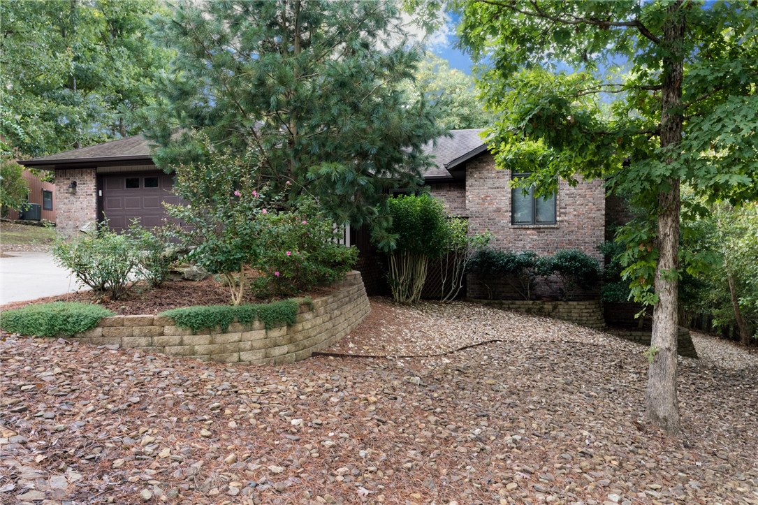 Must see! 500+ sq ft walk out basement:heated and cooled with a 1/2 bath(sq ft not included in 1845) Meticulously kept/move in ready home with hardwood floors, level driveway, and new HVAC in 2018. Located near Lake Rayburn with quick access to I-49/Hwy71. Covered large deck overlooking woods perfect for morning coffee above a low maintenance yard with tasteful landscaping. Don't miss out on this opportunity.