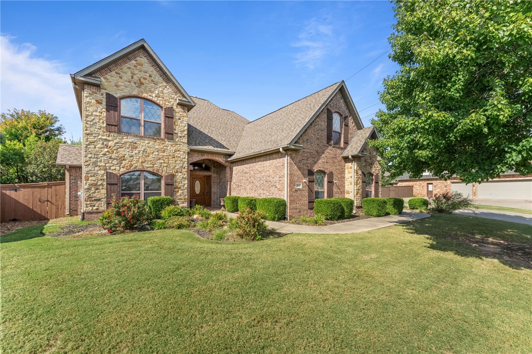 Welcome to this exceptional Lochmoor Club home, where classic design meets comfort. From the side-entry garage to the beautiful hardwood floors, every detail has been thoughtfully designed. The gourmet kitchen features double ovens, stainless steel appliances, a gas cooktop, and granite countertops, making it a true centerpiece for family gatherings and entertaining.Relax in the theater room with projector and wet bar, or unwind in the backyard oasis with a built-in grill, lush landscaping, and French drains. The spacious side yard offers plenty of room for play, pets, or a future pool! This home also includes a security system, central vacuum, irrigation, whole-house sound, and a large laundry room with sink, storage, and walk-in pantry. The primary suite offers a serene retreat with a custom walk-in closet and beautiful finishes. Located in a sought-after community with a pool, tennis, basketball, and playground—this home blends comfort, elegance, and lifestyle in one perfect package. This one won't last long!