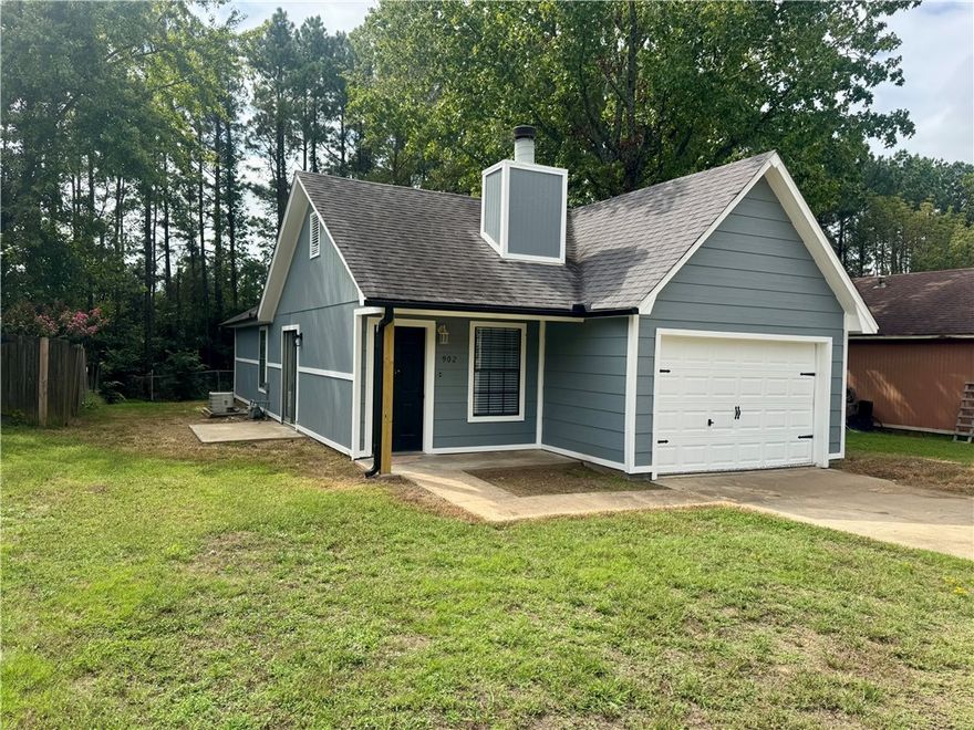 Modern, clean, and completely redone, this home at 902 E 23rd St is truly move-in ready. Step inside and you’ll notice the fresh, modern paint scheme that ties everything together. The kitchen pops with granite countertops, a stainless sink, a new stove and dishwasher, and fixtures that match perfectly. Both bathrooms have been upgraded with an upscale touch, featuring a custom-tiled shower and stylish finishes. Every surface feels fresh and intentional, from flooring to trim. This home is turnkey, easy to show, and ready for its next owner to enjoy. Schedule your tour today!