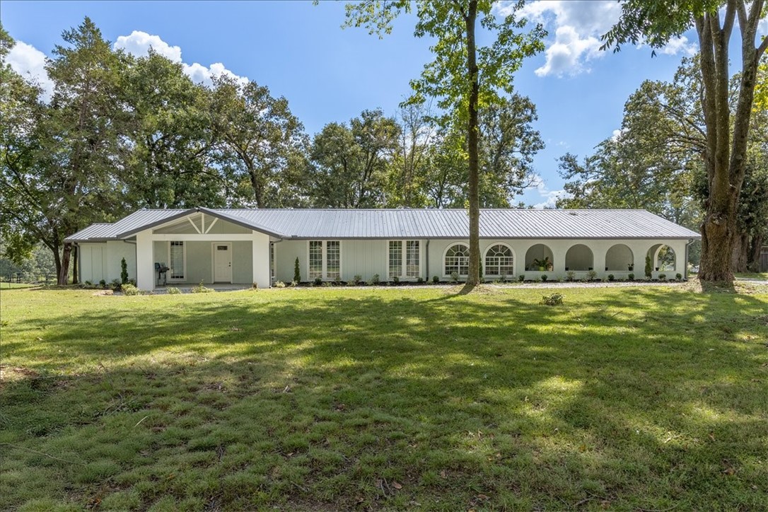 Come home to this beautifully remodeled home on 4 acres of Arkansas Beauty! This 3 bedroom 2 Bathroom home has lots of room to entertain and enjoy Razorback football on the large Back patio or sit in the serenity of large mature native trees on the front porch while sipping your favorite coffee! No stone was left unturned during the remodel and this home has a modern feel while stile maintaining that rustic ranch home style setting. The Barn/ shop is great for storage or chasing your favorite hobbies or hanging out and turning wrenches. Come see all this one has to offer!