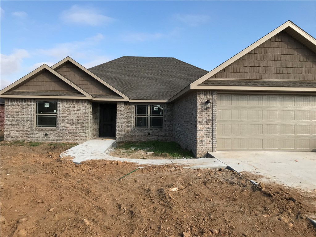 Quality New Construction in Bentonville schools for an awesome price! Hard to find four bedroom open floor plan with gorgeous designer finishes--Granite countertops, custom cabinets, elegant entryway, durable wood look tile, all brick maintenance free exterior, soothing color schemes, stainless appliances, custom shelved walk in closets, and covered porches make this home warm, inviting, and ready to be yours!