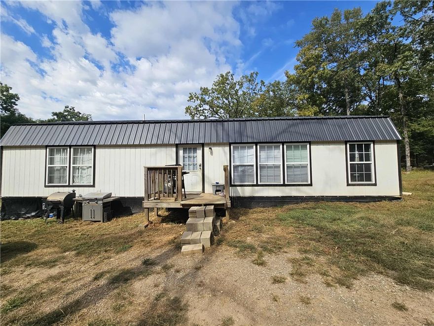 Secluded Country Escape on 1.77 Acres – Minutes from Adventure!

Looking for peace, privacy, and the perfect getaway? This charming 2-bedroom, 2-bath tiny home sits on 1.77 secluded acres, surrounded by nature and teeming with wildlife — deer and turkey are frequent visitors!

Enjoy the great outdoors with ATV trails and National Forest access just minutes away, plus Lake Fort Smith only 13 minutes from your door for boating, fishing, and hiking.

The property is all-electric with rural water and includes an RV hookup with electric, water, and sewer — ideal for guests, extended stays, or additional rental income.

Whether you’re dreaming of a hunting cabin, vacation retreat, Airbnb investment, or quiet full-time home, this property offers the perfect blend of comfort and adventure.

Peaceful, private, and move-in ready — your slice of the Ozarks awaits!