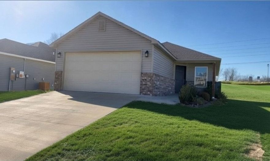 Charming 1,014 sq ft home offering comfort and convenience in a peaceful neighborhood setting. Situated on a spacious corner lot, this home features an open, split floor plan with a seamless flow between the living room and kitchen—perfect for everyday living and entertaining. Large walk-in closets provide ample storage, while the generous backyard offers endless possibilities to relax, garden, or create your ideal outdoor space. Ideally located between Fayetteville and Prairie Grove, this home provides easy access to the University of Arkansas, major job sites, shopping, schools, and daily essentials.