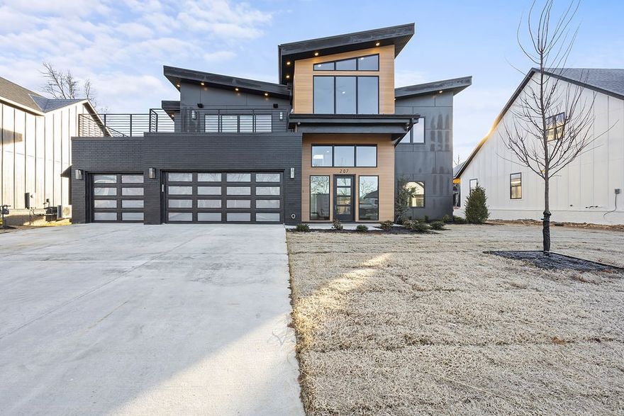 Modern stunner by Iron Gate Construction. Complete now and ready for move-in. Main level features a grand Kitchen, Great Room, half bath, laundry, and Master Ensuite. Every detail and finish in this home was so well thought out. Head upstairs for bedrooms 2, 3, and 4, a full bath, and a huge family and billiards room complete with a wet bar. Enjoy your views from the Trek decked rooftop patio. Other features include an on demand water heater, interior fire suppressant sprinkler, wired for security and sound.