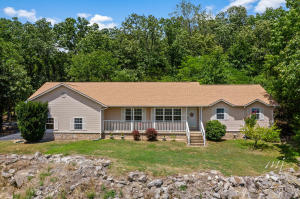 Beautiful mountain view and only 5 minutes to the Buffalo National River from this 3BR/3 BA home on 5.86 AC. Country feel to this beautiful home with many extras such as an oversized 2 car garage, asphalt driveway, 8 x 12 shed, deck off the kitchen, den or office with fireplace, view from your front porch and living room and many more. There are 3 bedrooms and 2 full baths on the main floor and 3 bedrooms and a full bath in the additional 1586sf unfinished basement with a large family room. NOTE: With at least a full asking price offer, sellers are offering a generous $15,000 cash back at closing to install a French drain, wainscot replaced in the basement, stain the concrete floor and repair nail holes and repaint the master bedroom.