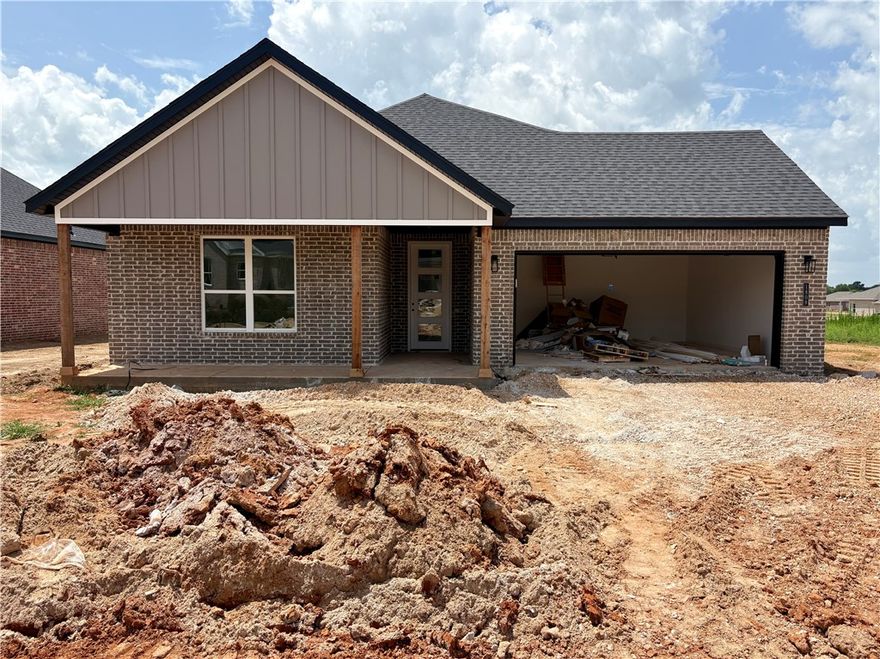 Pea Ridge welcomes you to its rapidly growing community. The Yorktown subdivision places you at the heart of it all, offering close proximity to schools, parks, and beautiful scenic views.This lot showcases the Cardinal Plan, where you're welcomed by LVP flooring and bright, airy touches that bring the home to life. All bedrooms are conveniently located on one side of the house, with two bedrooms and a bathroom at the front, while the primary suite is tucked at the back, next to the laundry room and two extra storage spaces. The kitchen, living, and dining areas flow seamlessly together, with the kitchen offering ample storage, including a walk-in shelved pantry. Enjoy outdoor living with both covered front and back patios