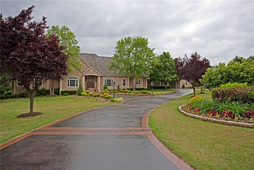 Beautiful 1 level estate home. Custom built by David Harris. Located in one of NWA's exclusive gated neighborhoods. This home offers expansive rooms, 2 park like areas. 42x21 heated salt water pool with pool house. Kitchen, master bedroom & master bath have been completely remodeled.