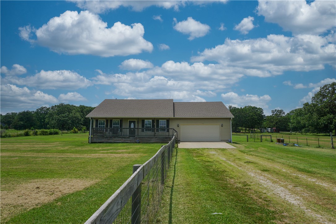 The whole package! Imagine those fancy cracker barrel rocking chairs, ice tea sipping, and front porch sunsets. The fenced three acres is perfect for all of your mini farm dreams. Just a 15min drive to Lincoln, 20min drive to Prairie Grove, 27min to Siloam Springs. All of the furnishings and appliances are negotiable. Will go RD, FHA, VA!