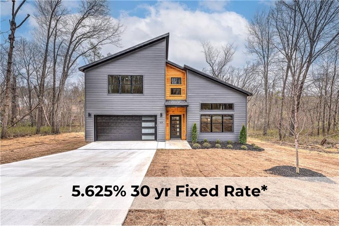Summer Special: Rate as low as 5.625%, payment as low as $2,355* with preferred lender. Plus closing costs paid if under contract by 7/20/2025. Welcome to your dream home! This gorgeous new construction offers the perfect blend of modern design, comfort, and convenience, all while boasting a serene backyard backdrop you'll love coming home to. Step inside to discover soaring vaulted ceilings and an open-concept design on the main level, seamlessly connecting living, dining, and kitchen spaces for effortless entertaining and daily living. The thoughtfully designed layout offers both style and function, with abundant natural light enhancing every corner. Upstairs, you'll find a versatile floor plan featuring one spacious bedroom, an office, and an additional bonus room—ideal for a home gym, playroom, or creative retreat. Perfectly situated in one of Bella Vista’s most desirable areas, this home is just minutes from top-rated schools, beautiful Loch Lomond Lake, scenic trails, and nearby parks.
