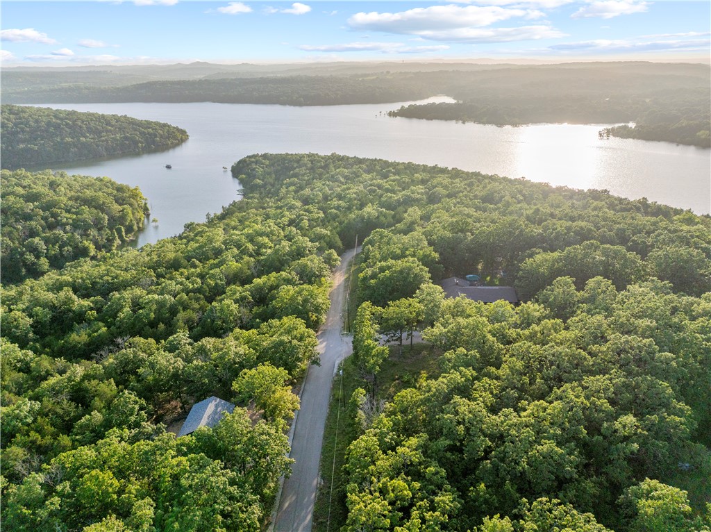 This cleared corner lot at Skyline & Diamond Point Blvd is ready and waiting for your vision. With public water, sewer, & electricity available (buyer to verify), you can skip the guesswork and get right to planning. Whether it's your weekend getaway, a full-time home, or a cozy fishing cabin—this is your chance to stake your claim near the shores of Bull Shoals Lake.
Living here means morning coffee with lake breezes, golf cart rides to the marina, and a tight-knit, small-town vibe where neighbors wave and the pace is slower. Diamond City is a hidden gem for those who crave lake life without the crowds. Let the water be your backyard, and let every day feel like vacation.
