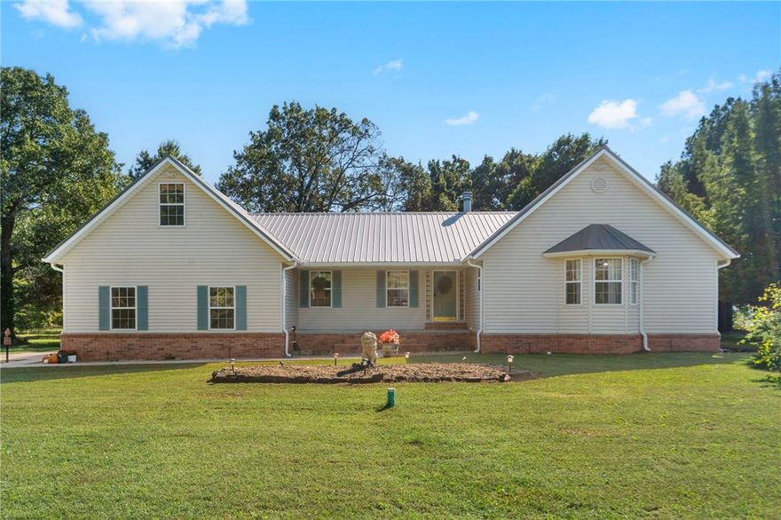 Custom-built home on 11.63 peaceful acres surrounded by mature pine trees for privacy. Thoughtfully remodeled in 2021 by the original owners, this property blends quality craftsmanship with modern efficiency. Solar panels keep the average electric bill around $50, and a durable metal roof provides long-term protection. Inside, the fireplace is ducted to the bedrooms and great room for efficient, cozy warmth. Outdoors, enjoy a natural pond, a 32x40 workshop, and a trellis ready for 120 vines—perfect for hobby winemakers. Conveniently located just 5 miles from I-49 and 25 minutes to the Walmart Home Office. Too many upgrades and amenities to list—see attached info sheet for full details. Homes like this are hard to find and don’t stay on the market for long—don’t miss your chance to make it yours!