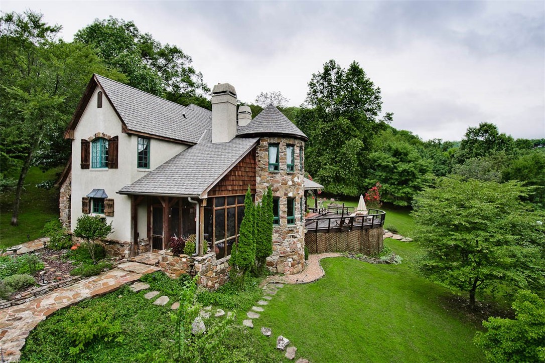 Almost level Beaver lake front property! Youāll probably not find a more gentle walk from your back door to your Private 2 slip boat dock! This One of a kind custom home has it all! The home was built with numerous custom touches, which include large hand-hewn timbers from an 1860āS era log cabin located on the Kings River. The exposed beams, archways, stone masonry, wood floors, antique stained glass & doors used throughout the home, create a cozy and inviting lodge atmosphere. The home features 5 bd (one a bunk room which sleeps 6), 3 full baths, office/study and new addition of a large game/movie room. There is also an unfinished 575 sq. ft. ofc/work room above the detached 2 car garage. The home has several fruit trees, a chicken coop built of barn wood, terraced gardens with two water basins & water fall feature. There is also a Grandfather Oak tree with swing and childrenās play area. New Quartz stone counters just added to Kitchen. The Owner's are offering this amazing property "TURN KEY"! No moving needed.