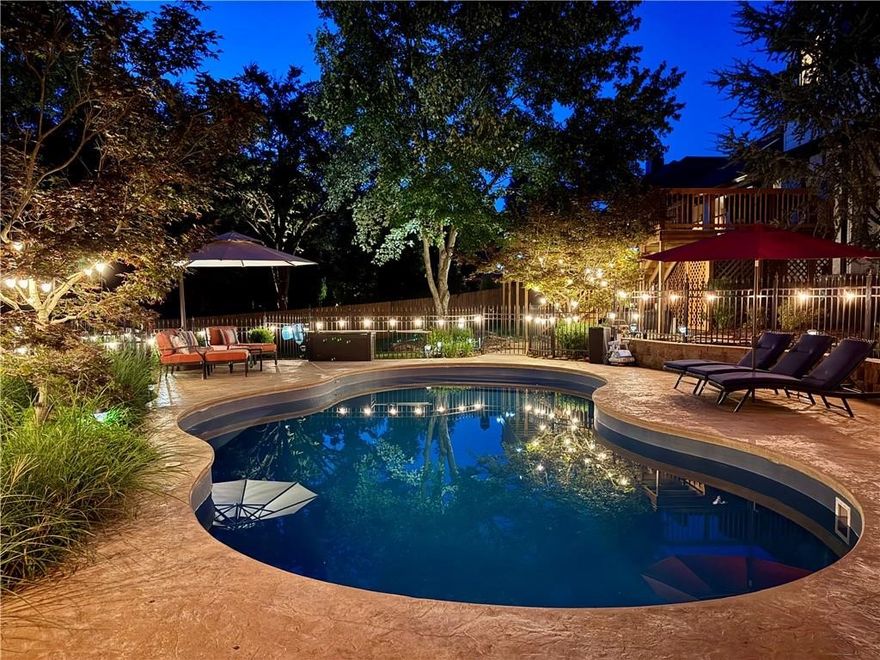 This stunning home in Savanna Estates features a split floor plan, hand-scraped oak floors & Anderson windows (2022). The kitchen offers quartz countertops, dual ovens (gas & electric), 6-burner gas range, professional vent hood, column refrigerator/freezer, ice maker, trash compactor, & high-end appliances. Custom cabinets include under-cabinet lighting, smart storage solutions, a walk-in pantry, & a cabinet pantry with rollout shelves. The laundry suite boasts a granite island, drop zone, window seat, & thoughtfully designed storage. The primary suite offers heated floors, a soaking tub, & a zero-entry dual-head shower. Additional features include surround sound downstairs & security system. The secondary suite has a full bath & reclaimed wood floor. Upstairs has a bonus room, full bath, office, craft room, & storage closet. Enjoy outdoor living with a privacy fence, wood deck (2024), iron-fenced vinyl pool with heated/cooled salt system, hardwired outdoor speakers, full-yard irrigation, & home generator conveys.