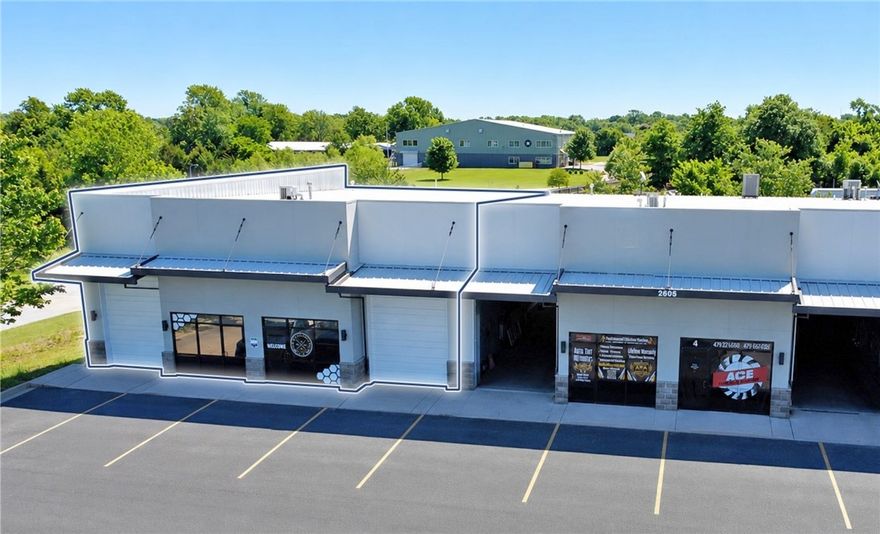 Available: 4,086 SF.
Rental rate: $14.00 PSF, NNN.
Grade-level doors: 2 (12' x 10').
Minimum wall height: 16'.
Peak height: 20'.
Parking: 6–8 spaces.
Power: Single phase.

This ±4,086 SF flex space offers a functional layout ideal for a variety of industrial, service, or warehouse users. The space includes approximately ±800 SF of office space featuring one reception and lobby area, one large private office, and a workshop area, providing a balance of office and operational functionality alongside the warehouse area. Additional property highlights include two grade-level doors (12’ x 10’), 16’ minimum wall height, 20’ peak height, single-phase power, and 6–8 parking spaces. Conveniently positioned just 2.9 miles from Interstate 49, the property offers excellent accessibility within one of Northwest Arkansas’ growing commercial corridors.