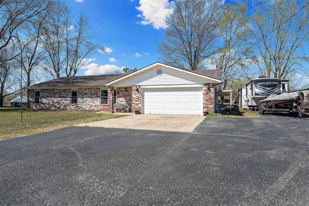 Ranch Style 3-bedroom, 2-bath home sits on 1.40 acres allowing for added space for your enjoyment. Covered back patio provides a relaxing atmosphere looking out on the huge backyard that is partially fenced. This house provides an excellent potential for someone who wants to have a home-based business with extra parking already in place along with RV 50amp service. This property is conveniently located off of Hwy 112 and close to I49 and next door to a new landscaping business. Whether you are looking for a great residential home on land or a potential business opportunity, this might be it. All buyers need to do their due diligence to verify zoning needed and businesses allowed with the City of Springdale.
