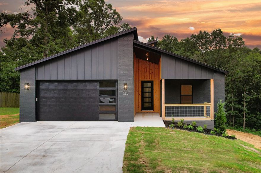 Beautifully crafted new Bella Vista home in quiet neighborhood with prime location! Just minutes from I-49, Lake Loch Lomond, Brittany Executive Golf Course, & Branchwood Rec Center (pickleball courts + Bella Vista’s only indoor pool). This 3-bed, 2-bath home offers striking curb appeal, with brick exterior & natural wood entry (car siding). Inside, you’ll find a bright, welcoming, open layout with luxury vinyl plank flooring, quartz countertops, stainless steel appliances, walk-in pantry, laundry room, cozy dining nook, walk-in closet, & extended back deck with peaceful view—perfect for morning coffee or evening unwinding. Recirculating hot water system boosts efficiency. Includes 2-YEAR builder warranty. Use preferred lender & receive $3,500 for closing costs, prepaids, or rate buy-down. Photos are from a prior build by the same builder with the same layout and similar finishes. Contact Donna Winn to explore more homes from this trusted builder. 2 Bed Septic