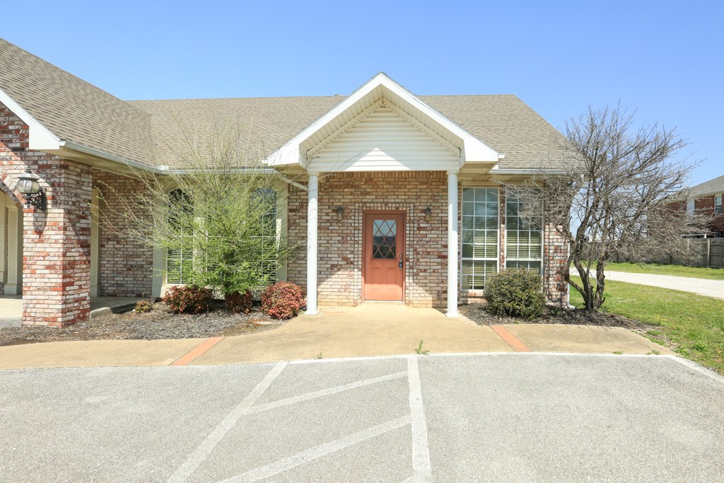 Commercial building plus warehouse right off I-49 Wagon Wheel exit. Updated brick building that could serve as office space for the warehouse which sits behind the building. 2,400 sf metal warehouse. This is a perfect space for a retailer needing a showroom along with warehouse storage for inventory. Owner will also consider leasing the office space and warehouse space separately. Monument signage included.
