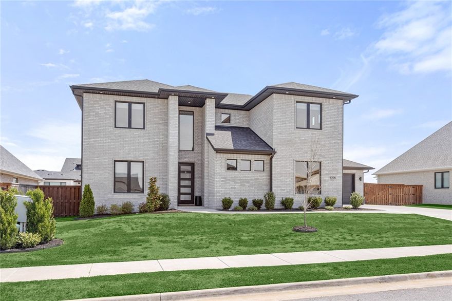 Luxury awaits inside this beautifully detailed & designed 4 bdrm, 4.5 bath home in Scissortail! Step inside the entry & be welcomed by the accent ceiling & large, picture windows along the back of the house showcasing the covered back porch w/ gas fire pit, perfect for outdoor relaxing. The open kitchen & living room are complete w/ floor to ceiling hearth & oversized island, making entertaining easy. The main level features a private master suite, along w/ a 2nd en-suite plus a separate home office. Upstairs are 2 addl bdrms & 2 baths (1 an en-suite & an oversized bonus room. This is a house that you want to call home! Conveniently located to I49, Pinnacle shopping, and just 20 minutes from the new Walmart home office.