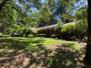 Looking for acreage in town? This park like setting on 3.36 acres provides a private oasis right in the middle of town! Wind your way up the drive to this solid, well-maintained brick home with 3 large bedrooms, 2 baths, living and dining room combination, den with fireplace and beautiful, shaded backyard. From the peaceful front porch you have a beautiful view of the wooded lot, the fire pit for roasting marshmallows and nature's playground all around. And don't miss the large (3 car) detached insulated garage/workshop with floored attic (built new in 2004). A unique property with so many possibilities! Check it out today!