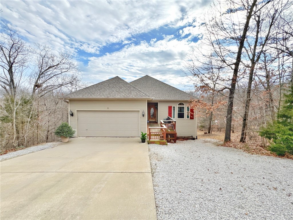 This charming home in the heart of Bella Vista offers privacy on both sides of the lake and seasonal views of Lake Brittany. Enjoy easy access to RAGO and Back 40 trails, along with walkable proximity to Lake Brittany. The spacious living room flows into a dining area and galley kitchen. The oversized primary suite on the main floor features an ensuite with dual vanities, a walk-in shower, a whirlpool tub, and a bathroom closet. Two additional bedrooms are located on the main floor, separated by a secondary bathroom. A fantastic bonus room in the basement can serve as a fourth bedroom and includes two access doors to the backyard, providing various possibilities for use. This home is ideally located to take full advantage of the many amenities Bella Vista offers. New roof and new HVAC added in 2024.