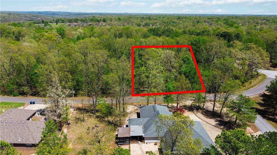 Discover the perfect spot to build your forever or vacation home at 3 Kintyre Dr, Bella Vista, AR 72715. Located in the sought-after Bella Vista community, this lot is just minutes from Lake Loch Lomond, parks, and scenic biking trails. The lot is gently rolling, making this the perfect place to build your home! Perc'd for a 3-bedroom home. Don’t miss this great opportunity to own in a beautiful and peaceful setting.