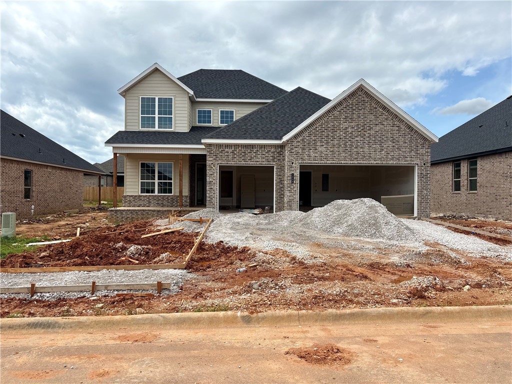 Pea Ridge is an up-and-coming community in Northwest Arkansas, Yorktown offers the perfect opportunity to find your dream home. This affordable, scenic, and well-maintained area caters to a variety of lifestyles, making it an ideal place to live. Upon entering the Willow Plan, you're welcomed by a charming front porch. Inside, an office space with wood accent walls greets you, LVP leads you into the open-concept living, kitchen, and dining area. The kitchen is equipped with 3CM granite countertops, custom cabinets, and a beautifully crafted wood hood. Conveniently located off the garage are cubbies, the utility room, and a powder room. The primary bedroom features exposed beams and an ensuite bathroom. Upstairs, you'll find three additional bedrooms, each with spacious walk-in closets.The covered back patio, perfect for relaxing or entertaining.For a limited time rates starting at 4.99% OR $7,500 from builder & up to $4K from preferred lender.