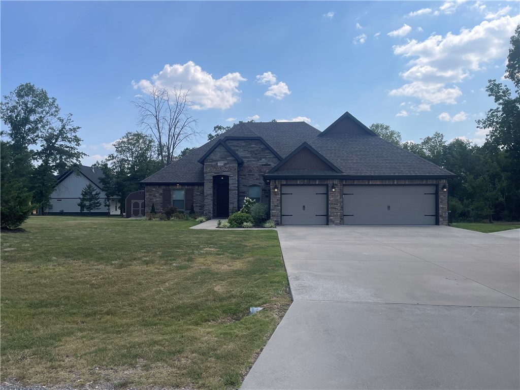 1 acre lot in beautiful rural wooded subdivision. 2 x 6 walls, open floor plan with bar, custom cabinets with granite tops, automatic whole house generator, fenced back yard, concrete RV pad with 30-amp outlet, LED Lighting in living room and master bedroom, security cameras, 3 zone HVAC. Extremely well-maintained home built by developer. Master bath has plumbing for tub if desired.