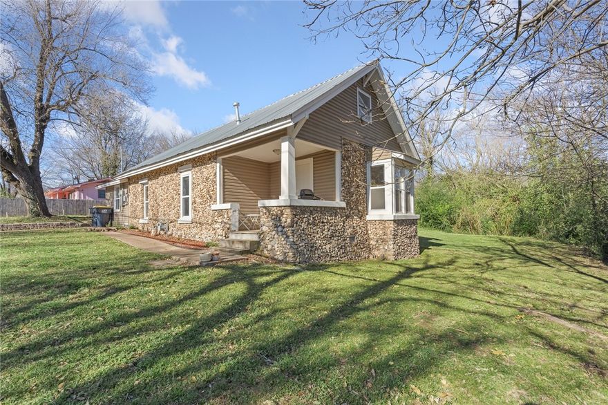 This charming 3-bedroom, 2-bath rock home features modern updates such as a metal roof, new carpeting, windows, kitchen cabinets, laminate flooring, and a great master shower! The heating and cooling square footage was increased when the garage was turned into an actual living space. Call today for a showing.