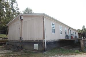 Near Harrison AR or Branson MO. Some remodeling to be completed. Several outbuildings.