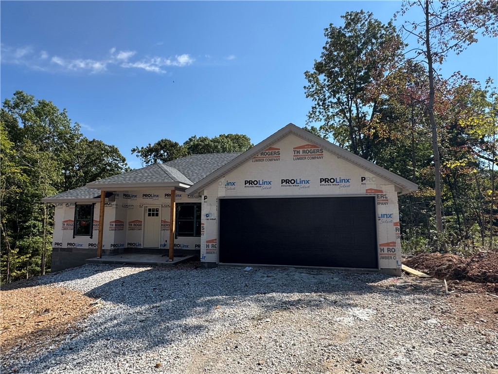 Quality built new construction home located on a quiet cut-de-sac close to Branchwood Recreation Center & Loch Lomond Park as well as a few miles from I49 to make commuting up and down the interstate easy peasy! OPEN & AIRY in the main living/dining space. Kitchen cabinets will have a warm neutral paint, white quartz countertops, creamy fluted backsplash, black door pulls, soft close cabinets & stainless steel appliances. Off the dining area is the pantry with a barn door. Main bedroom with have a custom feature wall, large walk- in closet, tile walk in shower & double vanity. LVP thru out the home for a seamless look, super durable and makes cleaning a breeze. This home has 2 bedrooms PLUS an extra room with a closet you could use as an office, playroom, game room, work out room or library, to name a few. Located 0.7 miles to Branchwood Nature Trail and Branchwood Recreation center, 2.3 miles to Loch Lomond Park, 3.2 miles Scotsdale Golf Course & about 20 minutes to exit 88 in Bentonville. Come see!