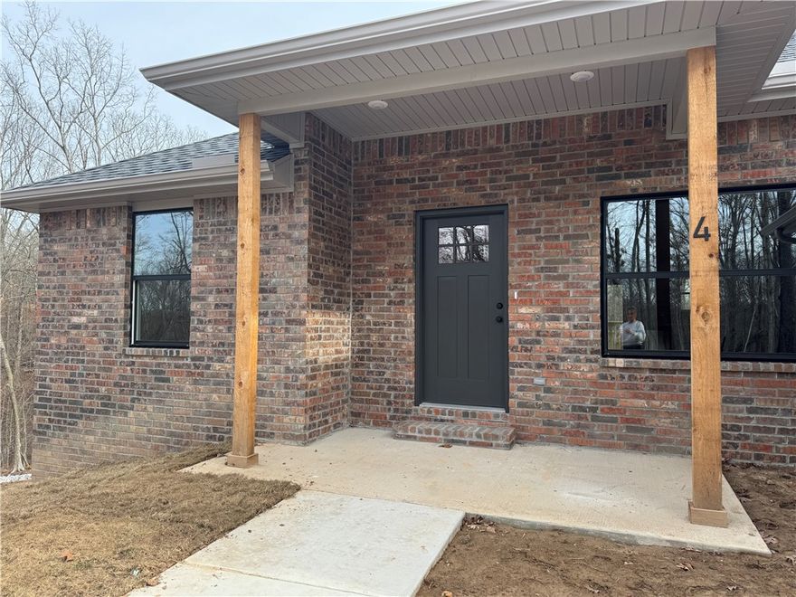 Quality built new construction home located on a quiet cut-de-sac close to Branchwood Recreation Center  & Loch Lomond Park as well as a few miles from I49 to make commuting up & down the interstate easy peasy!  You will love the WARMTH this home has as soon as you enter the property.  OPEN & AIRY in the main living/dining space.  Kitchen has quartz countertops, soft close cabinet/drawerss &  stainless steel appliances.  Off the dining area is the pantry with a barn door.  Main bedroom with have a custom feature wall, large walk- in closet, tile walk in shower & double vanity.  LVP thru out home for a seamless look, super durable & makes cleaning a breeze. 3 bedrooms but a 2 Bedroom septic system.   Located 0.7 miles to Branchwood Nature Trail and Branchwood Recreation center, 2.3 miles to Loch Lomond Park, 3.2 miles Scotsdale Golf Course & about 20 minutes to exit 88 in Bentonville.  $5000 LENDER CREDIT IF BUYER USES PREFERRED LENDER