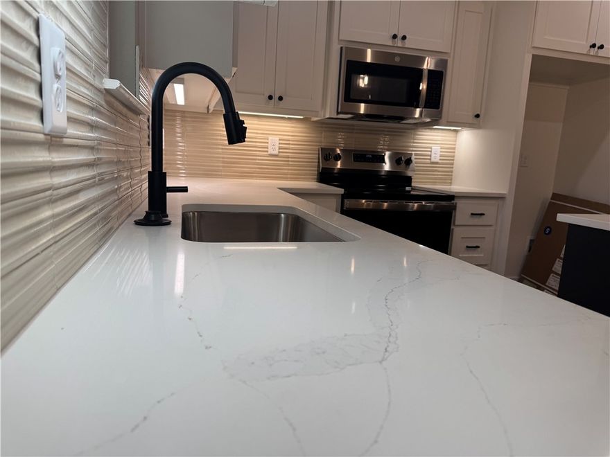 Quality built new construction home located on a quiet cut-de-sac close to Branchwood Recreation Center  & Loch Lomond Park as well as a few miles from I49 to make commuting up and down the interstate easy peasy!  You will love the WARMTH this home has as soon as you enter the property.  OPEN & AIRY in the main living/dining space.  Kitchen has quartz countertops, soft close cabinet/drawerss &  stainless steel appliances.  Off the dining area is the pantry with a barn door.  Main bedroom with have a custom feature wall, large walk- in closet, tile walk in shower & double vanity.  LVP thru out home for a seamless look, super durable & makes cleaning a breeze.  This home has 2 bedrooms PLUS an extra room with a closet you could use as an office, playroom, game room, work out room or library, to name a few.  Located 0.7 miles to Branchwood Nature Trail and Branchwood Recreation center, 2.3 miles to Loch Lomond Park, 3.2 miles Scotsdale Golf Course & about 20 minutes to exit 88 in Bentonville.  WOOD PRIVACY FENCE TOO