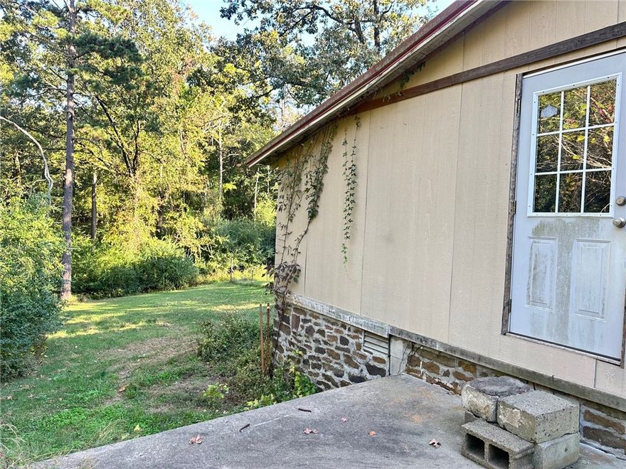 Tucked away on 1.49± acres, this secluded 2-bedroom, 1-bath home offers peaceful country living. Inside, you’ll find an open floor plan with laminate flooring throughout, a spacious dining area, and a walk-in shower. Three mini-split units keep the home comfortable year-round. The land is mostly cleared and partially fenced—ideal for pets, a garden, or simply enjoying the quiet surroundings.