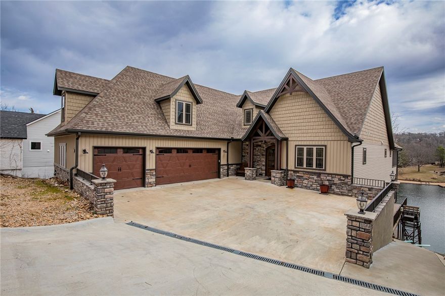 LIKE NEW, CUSTOM BUILT, LAKEFRONT PROPERTY Each level is accessible by stairs or the custom elevator.  Main level boasts a large, open floor plan featuring a 2-story living room, chef's kitchen w Blue Star appliances, oversized island & hidden butler's pantry.  Enjoy endless views of the lake from the 4 season sunroom or from 1 of 2 deck spaces. The primary bedroom & ensuite has direct deck access, auxiliary heated bathroom, Jettair tub, walkin shower w 3 shower heads, built in seat & is handicap accessible.  The lower level features 1 bedroom w ensuite, 1 bedroom w shared bathroom, kitchenette, finished workroom, 2nd laundry room w storage & screened in porch area w a Caldera Utopia FreshWater® Salt System spa.  The 3rd level has a full bathroom & oversized bonus room.  7" white oak wood floor throughout the home. Venture down via spiral stairs or the custom built, wheelchair accessible tram to the boathouse w 2 boat slips (21' & 17'), swim deck, ladder & 12 foot deep water.  See attachment for additional details.