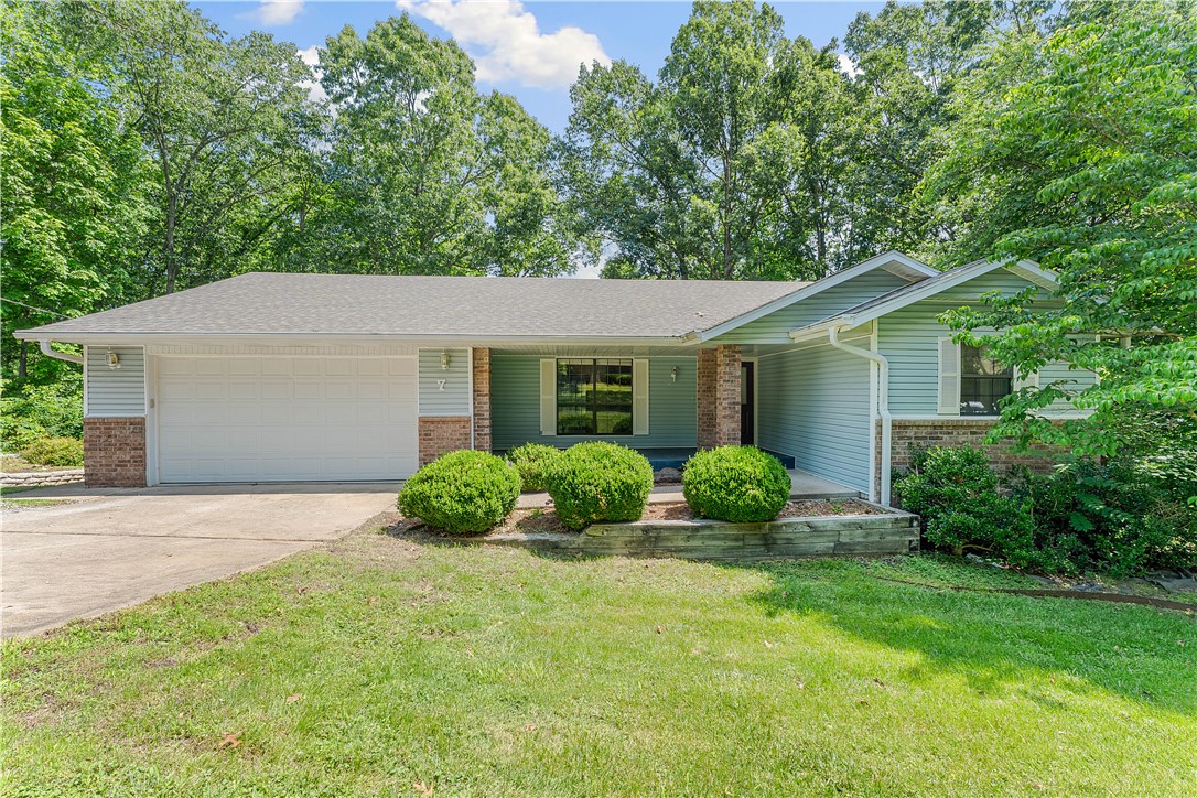 Welcome home to this well maintained 2-bedroom, 2-bath home with 2 lots, ideally located within walking distance of Lake Avalon Park and offers easy access to Bamboozled Trailhead. The layout features a cozy living area featuring a brick fireplace with gas log insert/remote, which flows into the dining space, perfect for entertaining friends and family. The kitchen is well equipped with plenty of cabinets, steel countertops w/island, making meal preparation a delight. The heated/cooled sunroom connects to the living space, a perfect spot to relax and enjoy the natural night year-round. Each bedroom is generously sized, providing ample storage and comfort, while the two bathrooms are thoughtfully designed for convenience. The outdoor space offers a screened in porch for relaxation or simply enjoying nature. The 232 sq ft garage/workshop with concrete flooring is perfect for hobbies or storage. Don't miss this opportunity to make it yours!