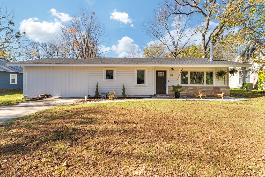 Completely remodeled in 2023, this charming home sits right in the heart of Prairie Grove. Conveniently located near the historic downtown area, you'll enjoy being able to walk to local shops, restaurants, the local hardware store or coffee shop, and local farmers market! The elementary school is less than a mile from the home and junior high is within a half mile. This lovely home has been updated from tip to tail with great care afforded to maintaining the home's character and charm to blend harmoniously with the warm, vibrant, and historic community. Also, with a new roof, hvac, water heater, and appliances there will be no stressing over the big ticket maintenance items. You can focus on the joys of entertaining friends and family in the spacious living room around the cozy fireplace, serving up gourmet meals in the beautifully renovated kitchen, or firing up the grill in the large, shaded back yard with mature trees. And, to make this deal even better, the Seller is offering $3,500 in Closing Costs!