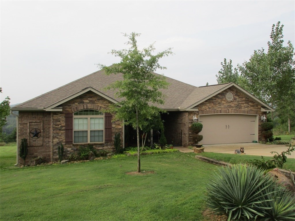 Beautiful home with stunning views and privacy! 3 bedrooms, 2 bathrooms, 2 car garage, wood burning fireplace, formal dining room, breakfast area, and sun room. Stained concrete floors, granite counter tops. Master bath has separate shower and whirlpool tub, lots of storage. nice chicken coop, beautiful yard. End of road privacy. More land is available.