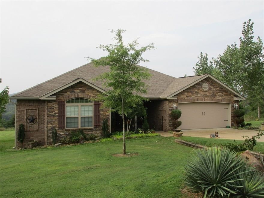 Beautiful home with stunning views and privacy!  3 bedrooms, 2 bathrooms, 2 car garage, wood burning fireplace, formal dining room, breakfast area, and sun room. Stained concrete floors, granite counter tops. Master bath has separate shower and whirlpool tub,  lots of storage. nice chicken coop, beautiful yard. End of road privacy. More land is available.