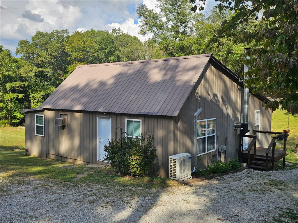 Back on market at no fault of the seller, this time with a brand new mini split heat/AC installed.
Tucked in the hills of Madison County, this cozy remodeled cabin in the woods, sits on 10 secluded acres. Renovated top to bottom in 2016, it features energy-efficient upgrades throughout.
Carefully planned with ease in mind, the property offers a complete auto irrigation system servicing the garden, flower beds, and chicken house doing the hard work for you. The impressive two-story chicken house includes solar-powered doors, a zap fence, open air runs and a terrace, and separate bays for breeding, hatching, and living. The perfect homestead setup.
The acreage offers mature timber and lots of wildlife.
An abundant spring water system and pump house supplies the home and land, giving you, off-grid potential all while staying within reach of available WiFi. Whether you’re raising livestock, growing your own food, or simply seeking a more simple life outside of town, this property is perfect for you.
