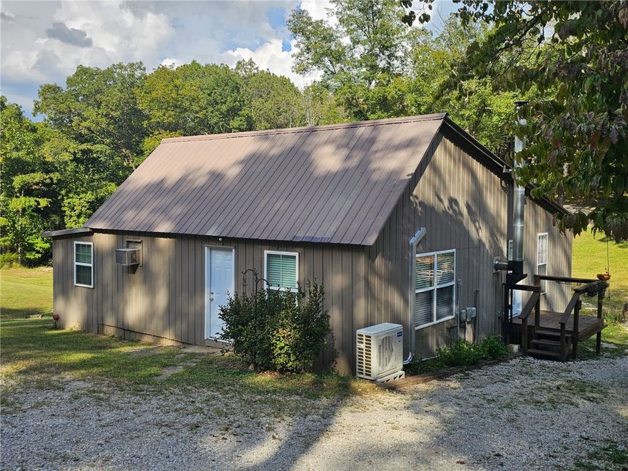 Back on market at no fault of the seller, this time with a brand new mini split heat/AC installed. 
Tucked in the hills of Madison County, this cozy remodeled cabin in the woods, sits on 10 secluded acres. Renovated top to bottom in 2016, it features energy-efficient upgrades throughout.

 Carefully planned with ease in mind, the property offers a complete auto irrigation system servicing the garden, flower beds, and chicken house doing the hard work for you. The impressive two-story chicken house includes solar-powered doors, a zap fence, open air runs and a terrace, and separate bays for breeding, hatching, and living. The perfect homestead setup.
The acreage offers mature timber and lots of wildlife.
An abundant spring water system and pump house supplies the home and land, giving you, off-grid potential all while staying within reach of available WiFi. Whether you’re raising livestock, growing your own food, or simply seeking a more simple life outside of town, this property is perfect for you.