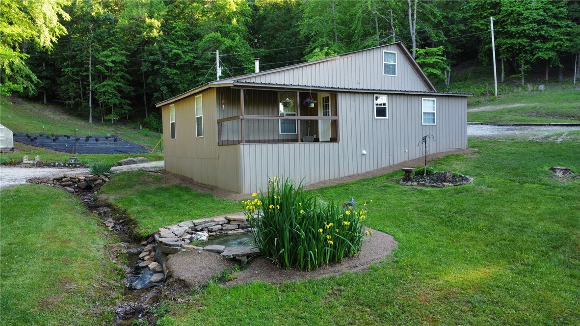 Tucked in the hills of Madison County, this cozy remodeled cabin in the woods, sits on 10 secluded acres. Renovated top to bottom in 2016, it features energy-efficient upgrades throughout.
Carefully planned with ease in mind, the property offers a complete auto irrigation system servicing the garden, flower beds, and chicken house doing the hard work for you. The impressive two-story chicken house includes solar-powered doors, a zap fence, open air runs and a terrace, and separate bays for breeding, hatching, and living. The perfect homestead setup.
The acreage offers mature timber and lots of wildlife.
An abundant spring water system and pump house supplies the home and land, giving you, off-grid potential all while staying within reach of available WiFi. Whether you’re raising livestock, growing your own food, or simply seeking a more simple life outside of town, this property is perfect for you.