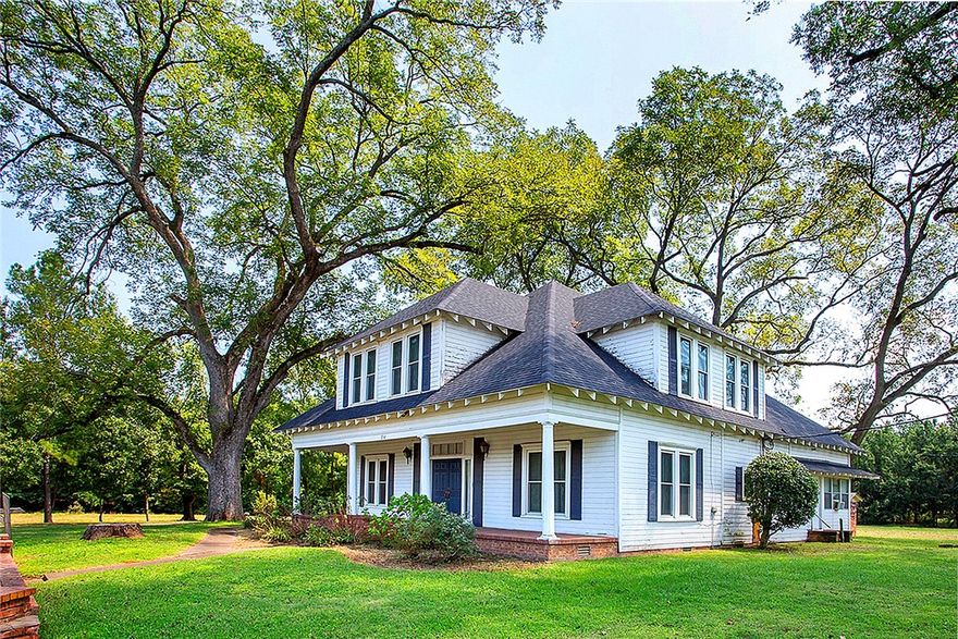 This lovely farmhouse invites you to imagine generations gathering beside its cozy fireplace. Downstairs, beneath a modern carpet, original wood flooring—still robust and beautiful—awaits restoration by your own loving hand. Solid cherry and walnut paneling throughout speak to a legacy of quality and elegance.
Two sun-drenched sunrooms provide irresistible seasonal retreats— through spring blooms or fall's 
The property includes equipment & hay barn and a detached garage.  5.76 Acres with a stocked pond.