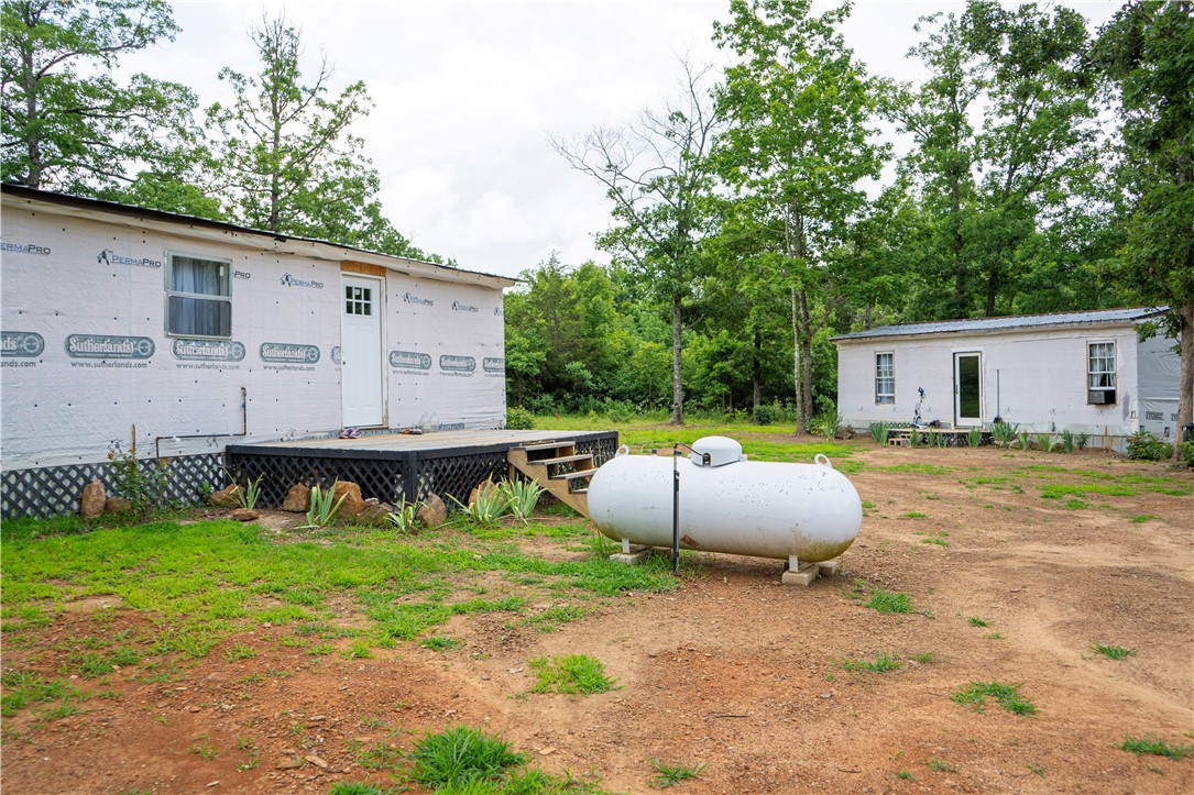 Have you been wanting a chance to own your own part of the Ozarks? Here is the perfect opportunity to 5.02 cares with 2 tiny homes and a pond! The first home is 20x32 and the second home is 16x32. Each home has 3 bedrooms and 1 bathroom. They need work to be completely finished, but both are livable now! There are so many options with this property, it has multiple building sites and 2 tiny homes that could be used to live in while you build your dream home. Enjoy the nature this property has to offer and the endless possibilities! Whether you are looking to live simply, build your dream home, or own land this property could be for you! Being sold as is!